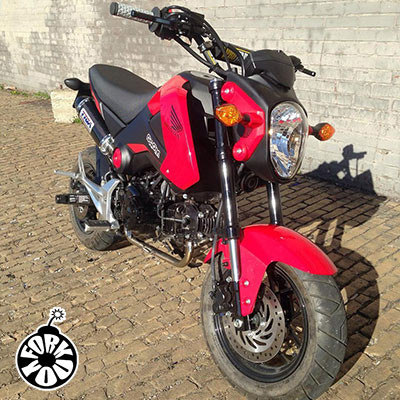 Customer from Kentucky sent in a photo of his Red Honda Grom with our Gloss Black Fork You wraps installed. 