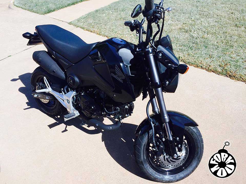 Customer ordered a custom color and sent me this photo of their Grom with Dark Matte Gray Fork You wraps installed. 